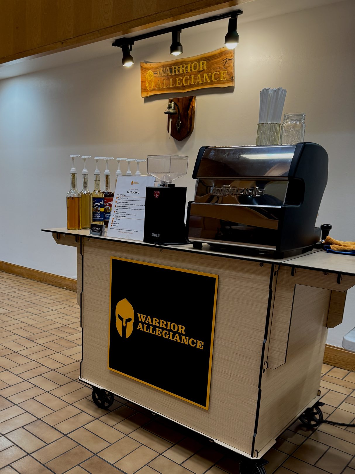 The Esencia Coffee cart with the Warrior Allegiance logo, set up for their team in their office